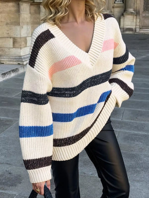 Oversized cream acrylic sweater with multicolor stripes and V-neck.