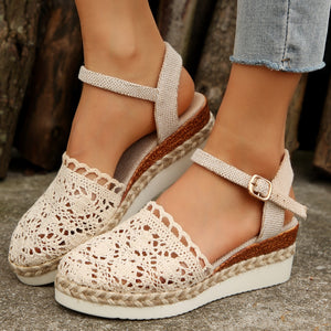 Ivory crochet espadrille sandals with ankle strap and jute sole detail.