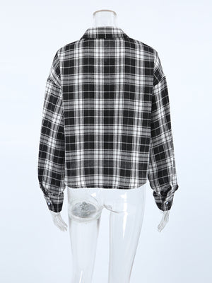 Oversized black and white plaid cotton button-up shirt with collar and cuffs.