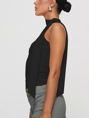 Black sleeveless mock neck top with tie detail, paired with grey shorts.