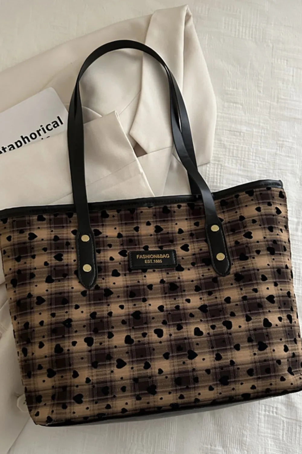 Camel plaid tote bag with black leather trim and all-over heart pattern