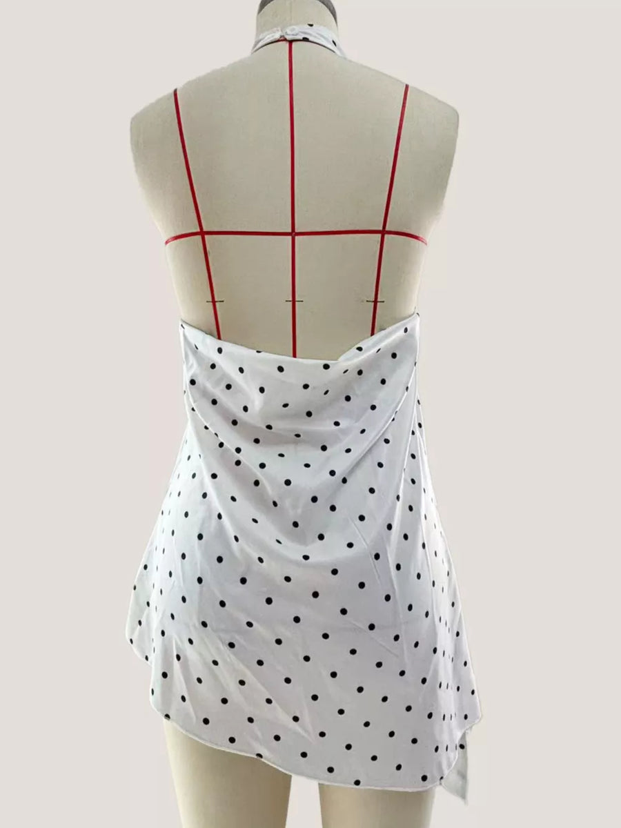 White polka dot halter top with draped asymmetrical hem