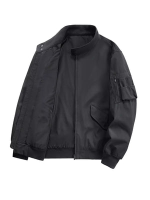 Plus-size black bomber jacket with zip pockets and snap collar detail.