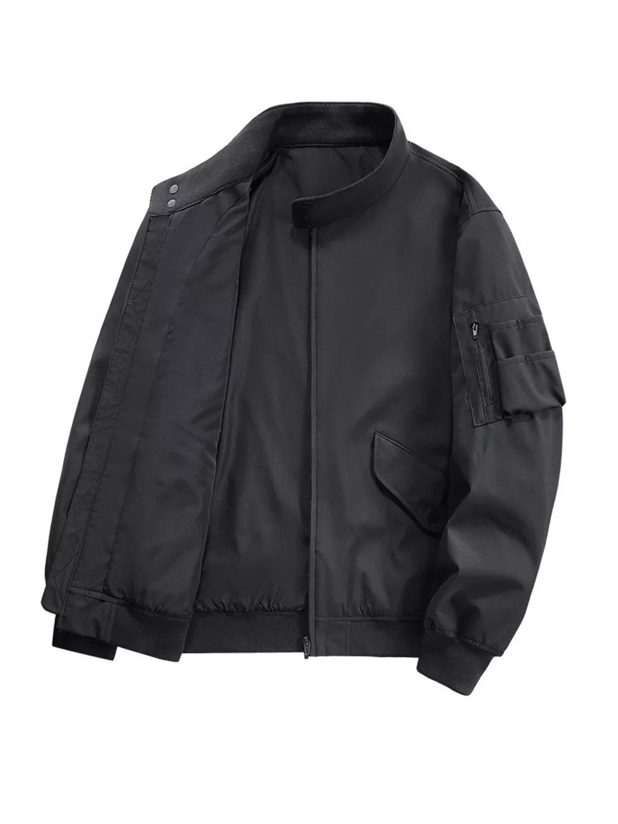 Plus-size black bomber jacket with zip pockets and snap collar detail.