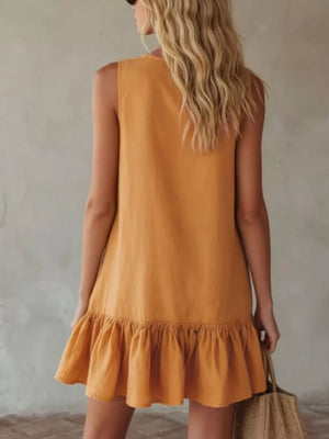 Turmeric mini dress with sleeveless design and ruffled hem.