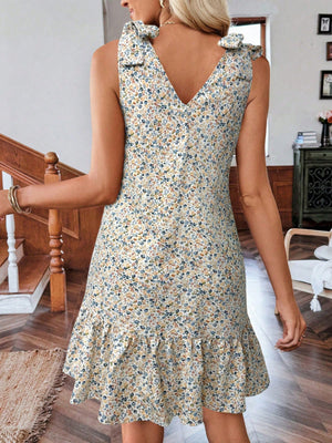Floral tie strap mini dress in off-white with ruffled hem and V-neckline.