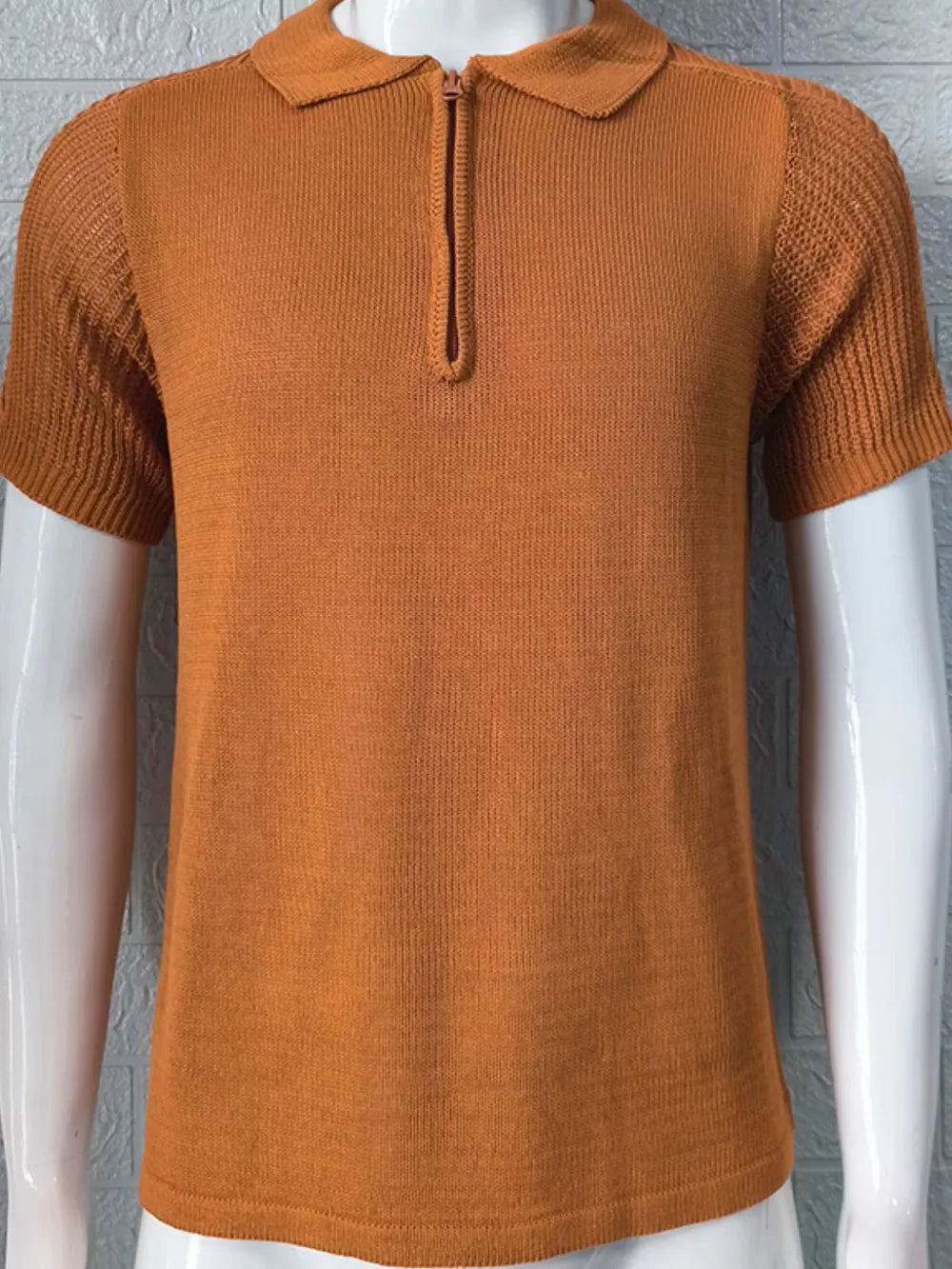 Textured knit polo shirt in caramel with short sleeves and a zip neck.