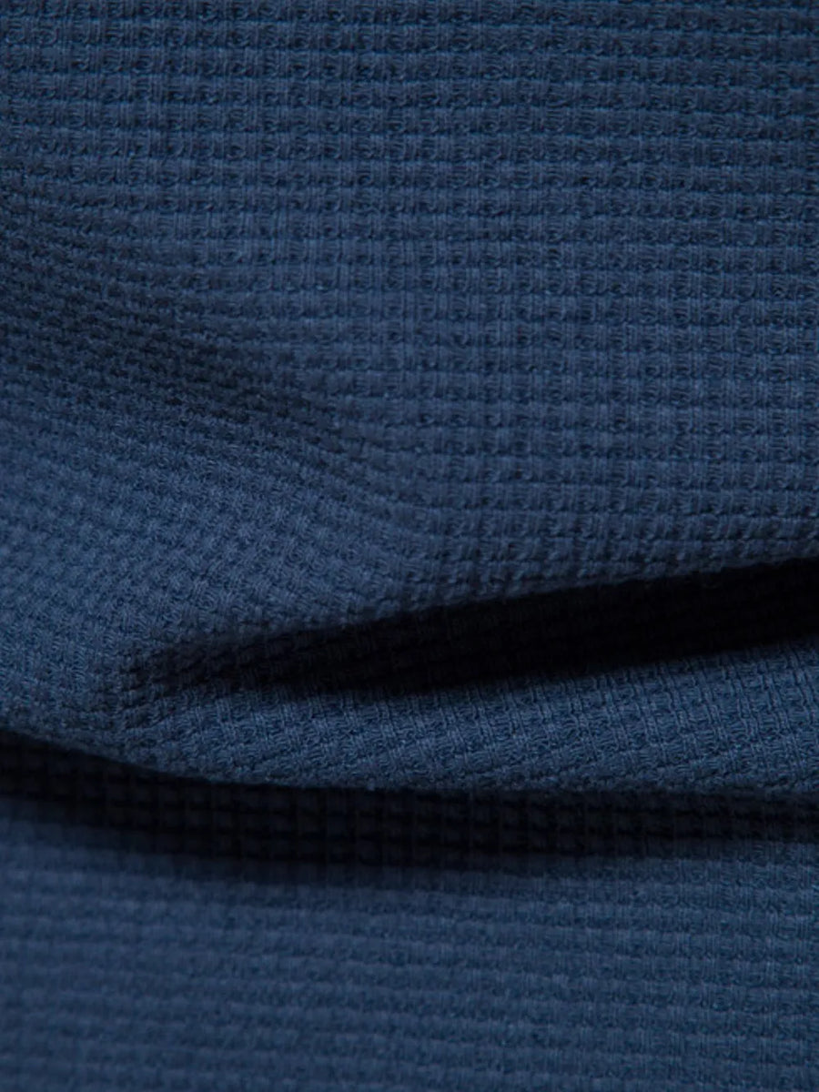 Navy textured crew-neck t-shirt knit with a waffle weave pattern.