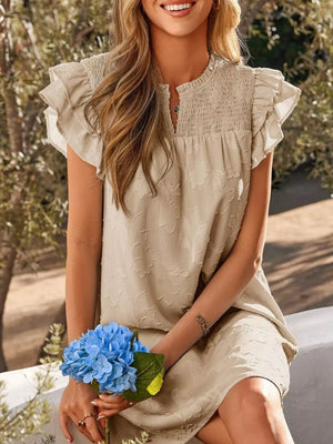 Apricot floral embossed mini dress with smocked neckline and ruffled sleeves