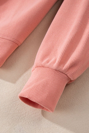 Pink ribbed sweater with long sleeves