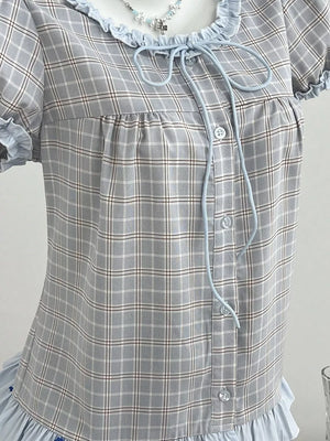 light blue blouse featuring tied and plaid