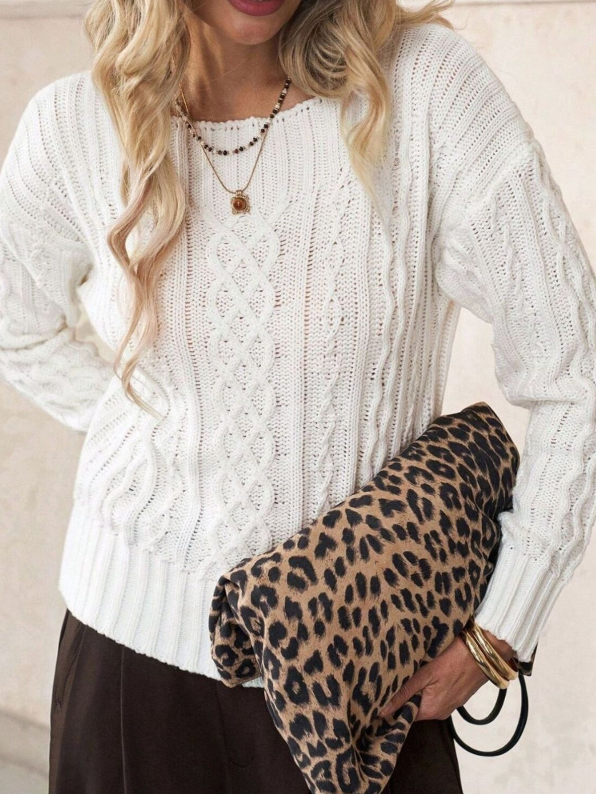 ivory pullover sweater with cable knit and round neck