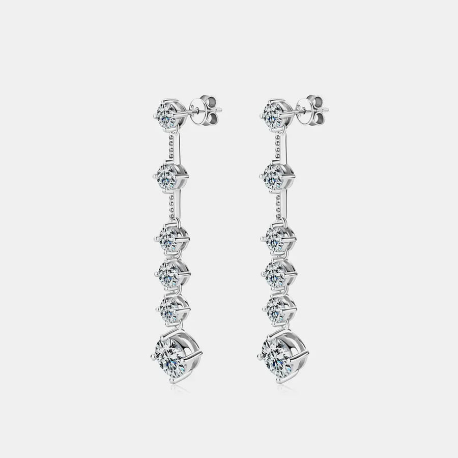 Silver cascading diamond drop earrings with multiple brilliant-cut stones.