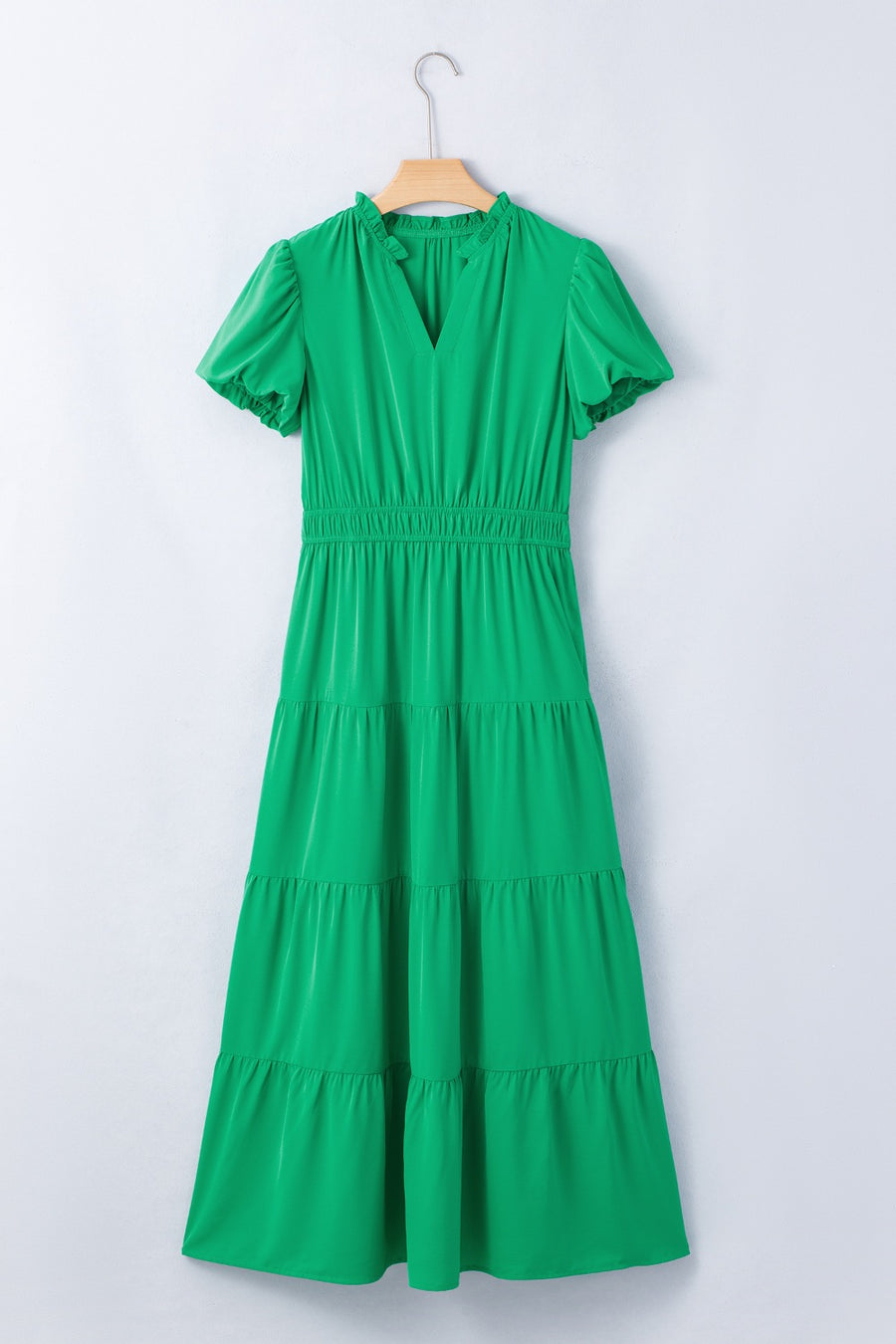 Green tiered maxi dress with puff sleeves and ruffled V-neckline