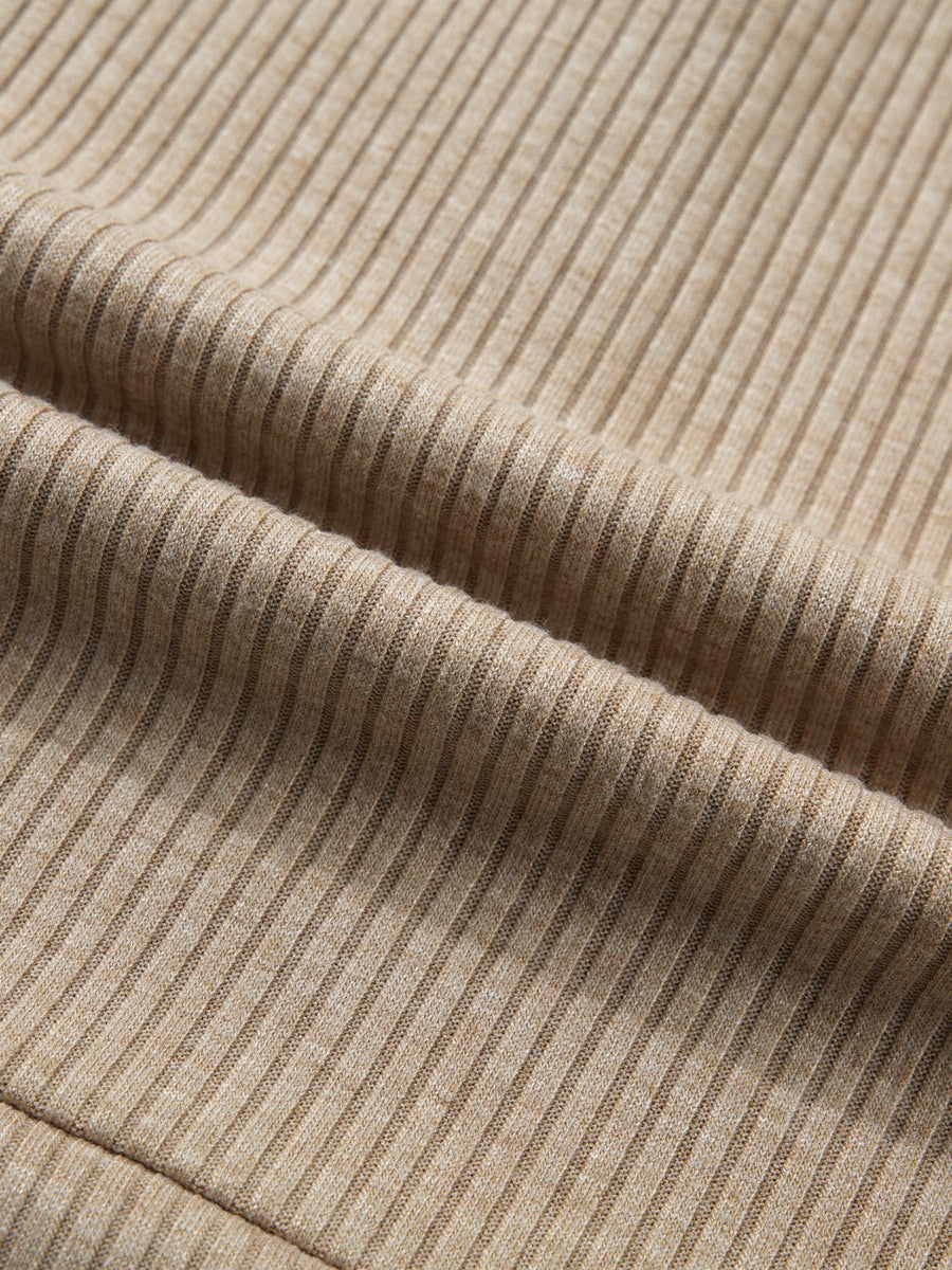 Cozy ribbed knit maternity shirt in beige with subtle denim accents.