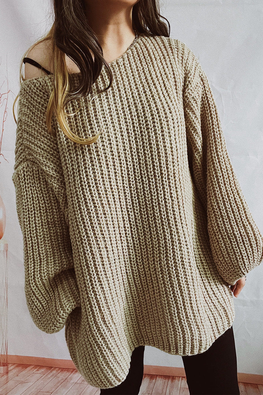 Oversized mocha ribbed knit sweater with boat neck and balloon sleeves.
