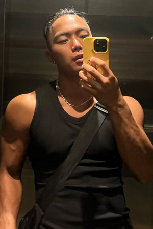 Black ribbed cotton muscle tank top with a round neckline.