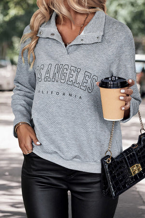 Textured henley sweatshirt in grey with Los Angeles graphic and snap collar.