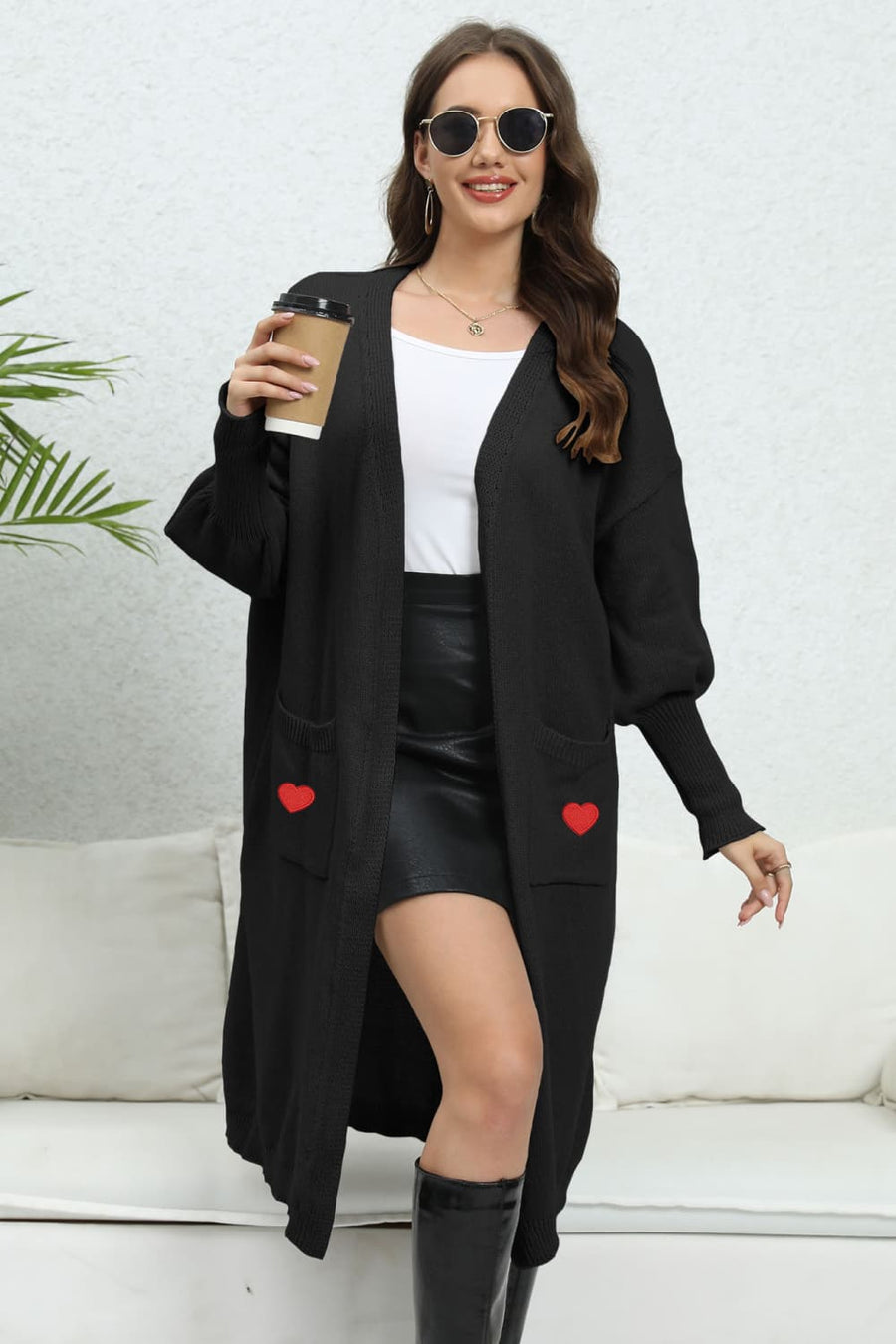 Black long cardigan with balloon sleeves and red heart pocket details