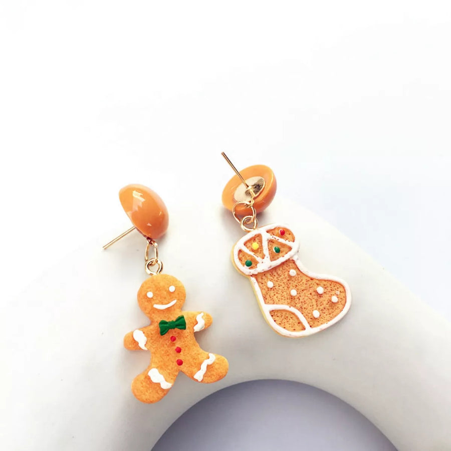 Gingerbread man and Christmas stocking dangle earrings with orange stud backs.
