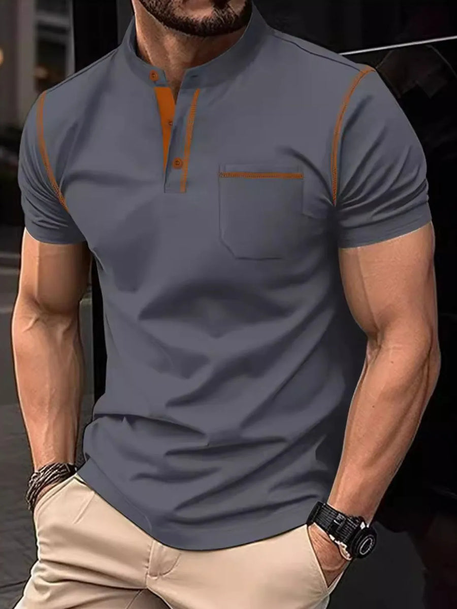 Dark Gray polo shirt with mandarin collar, contrast orange stitching, and chest pocket.