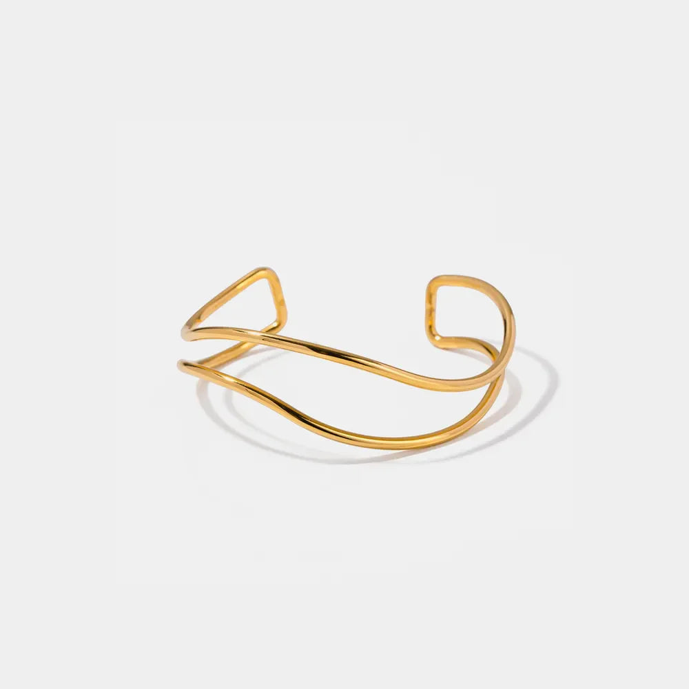 Gold double-band cuff bracelet with sculpted, wavy design
