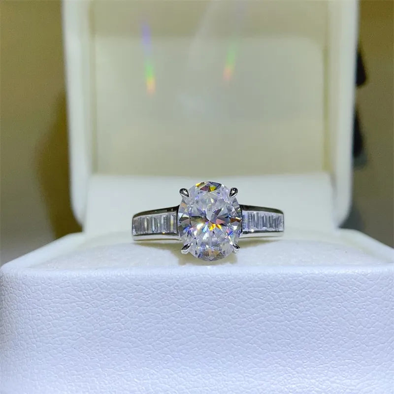 Silver oval cut engagement ring with baguette band