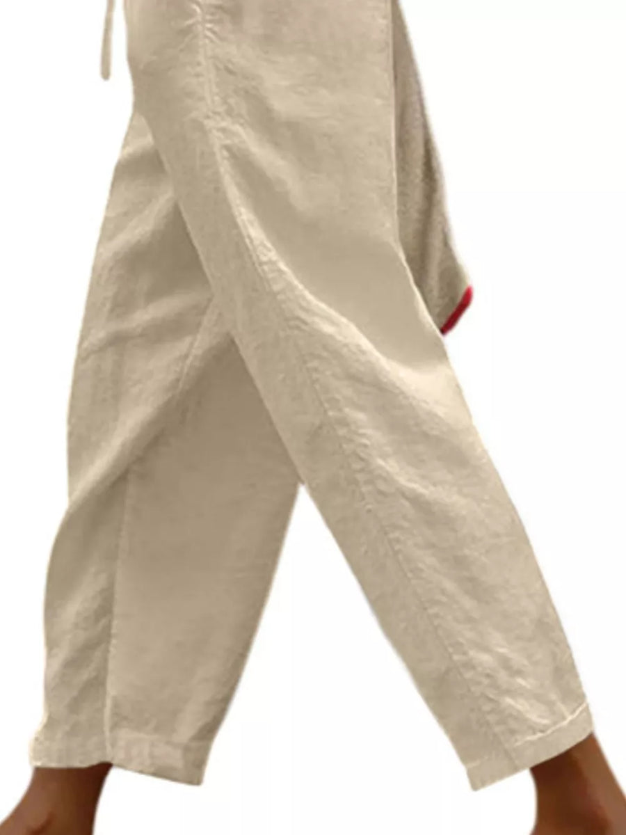 Relaxed fit cropped maternity pants in tan with drawstring detail.