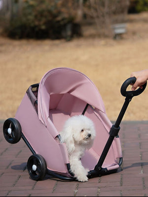 Pink foldable pet stroller with a white dog inside, showing the adjustable canopy and handle.