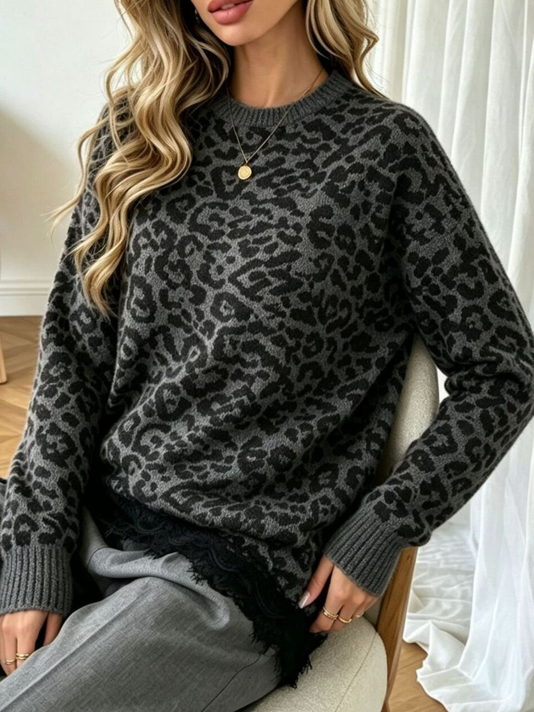 Gray pullover sweater with asymmetrical hem and long sleeve