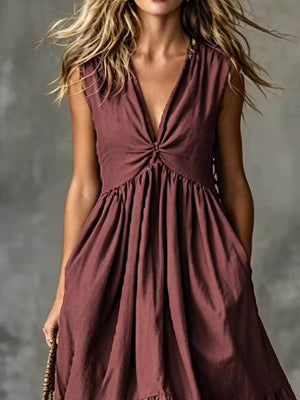 Sleeveless plum linen blend dress with deep V-neck and knotted bust detail, gathered waist and pockets.