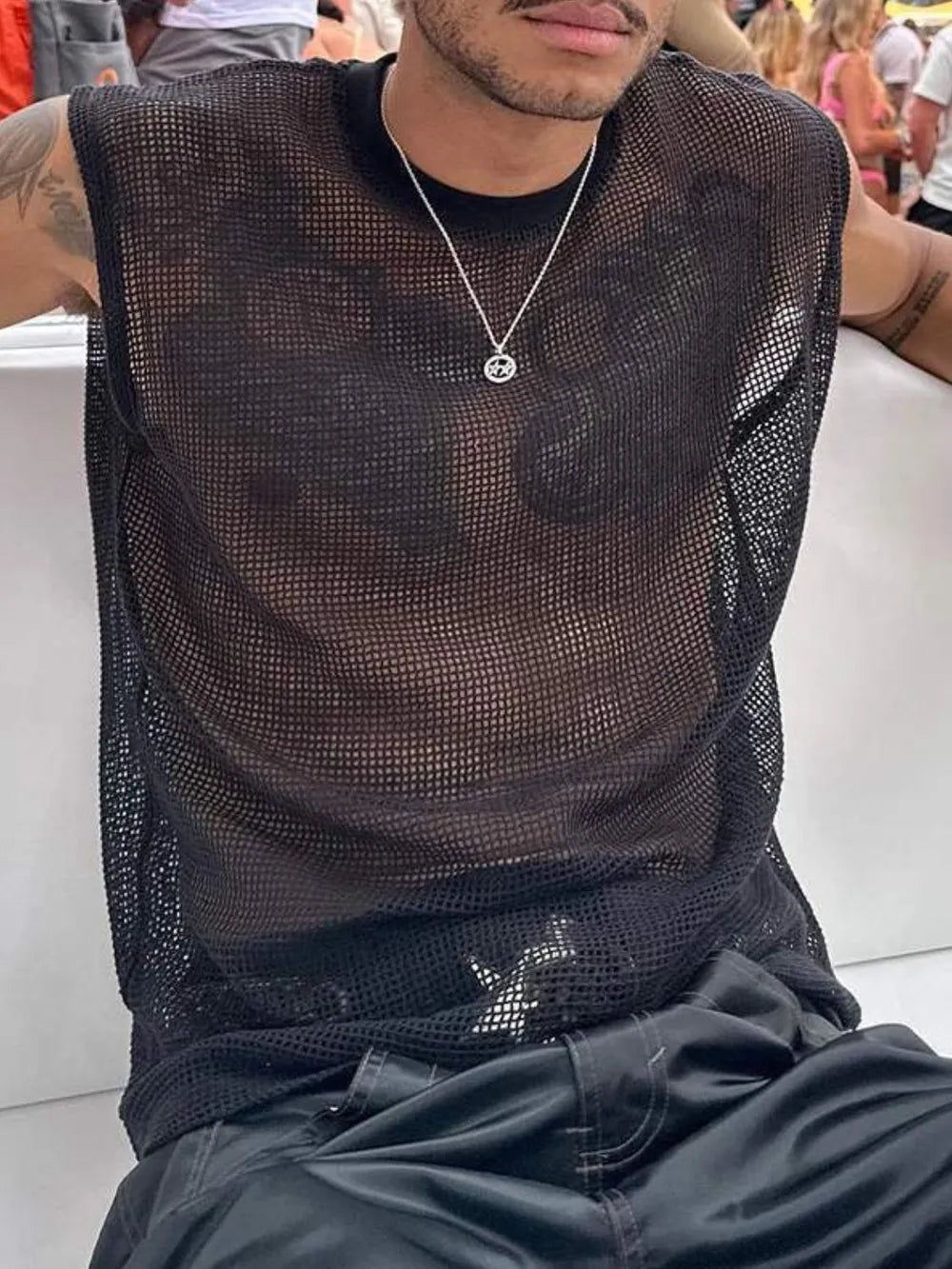Black open-knit sleeveless mesh tank top with crew neck.