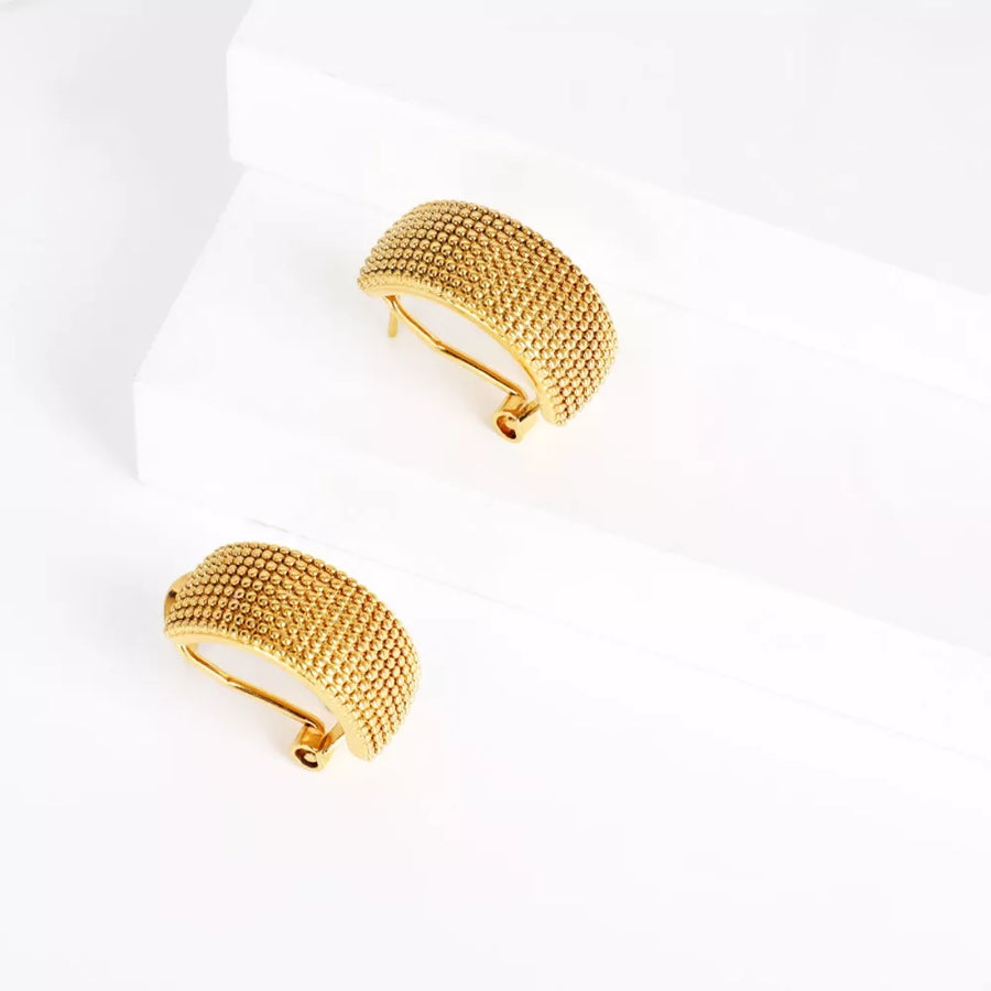 Gold earrings featuring textured and textured