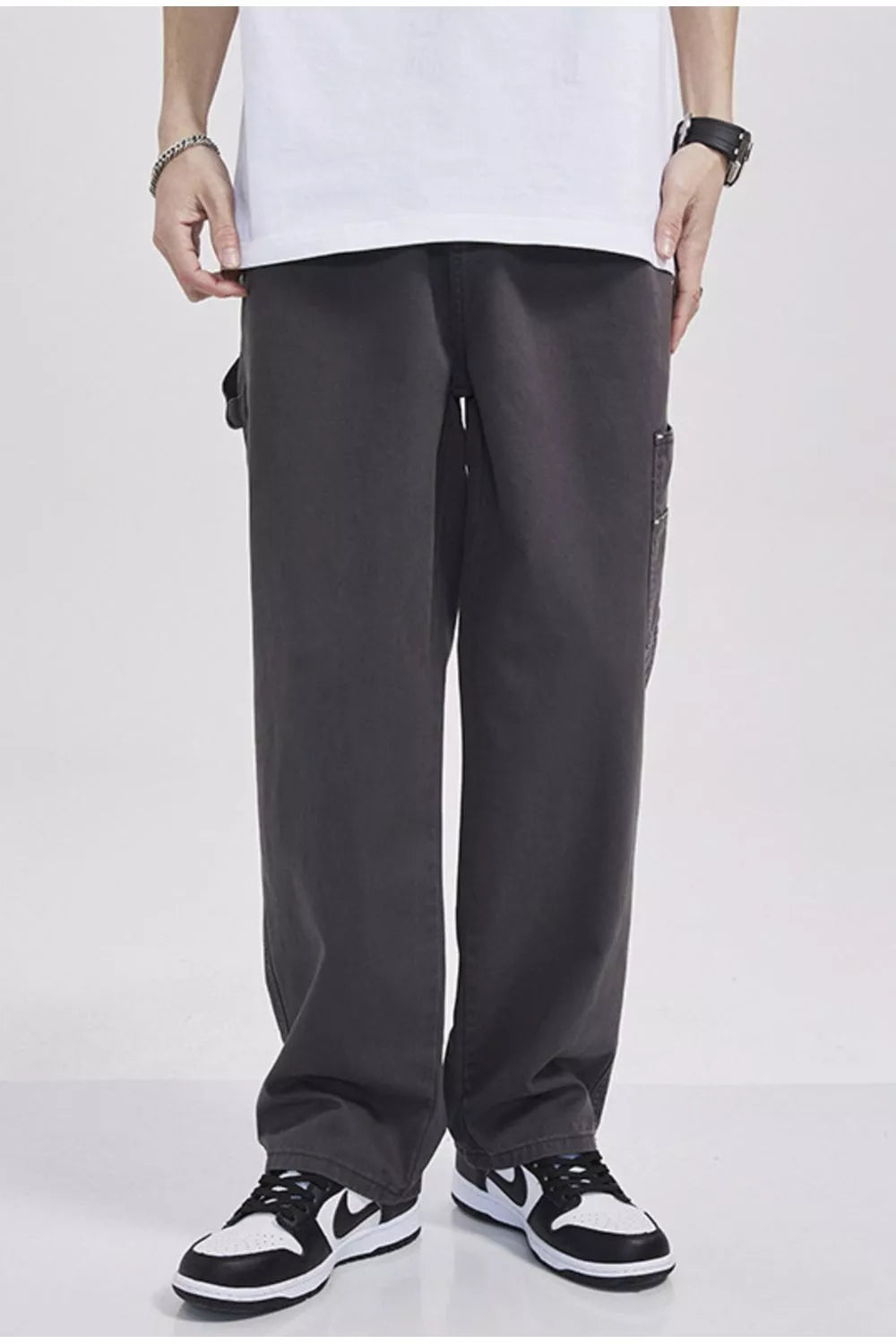 Relaxed fit dark gray cargo sweatpants with utility pocket detail.