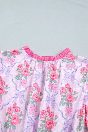 Floral tiered ruffle dress with pink roses and bows on a light pink polka dot background.