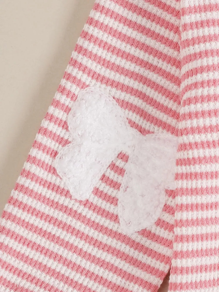 Baby set with pink and white stripes and a white bow accent.