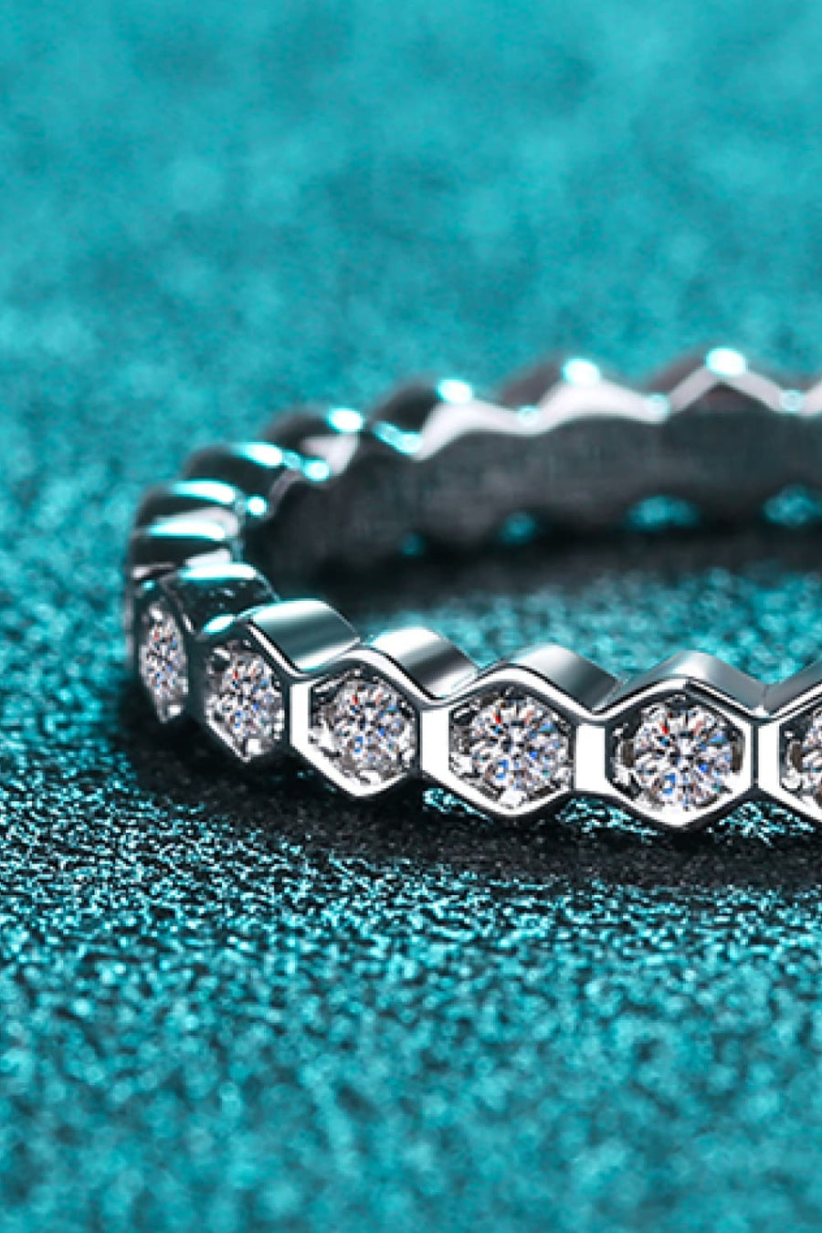 Silver eternity ring with hexagonal settings and clear stones