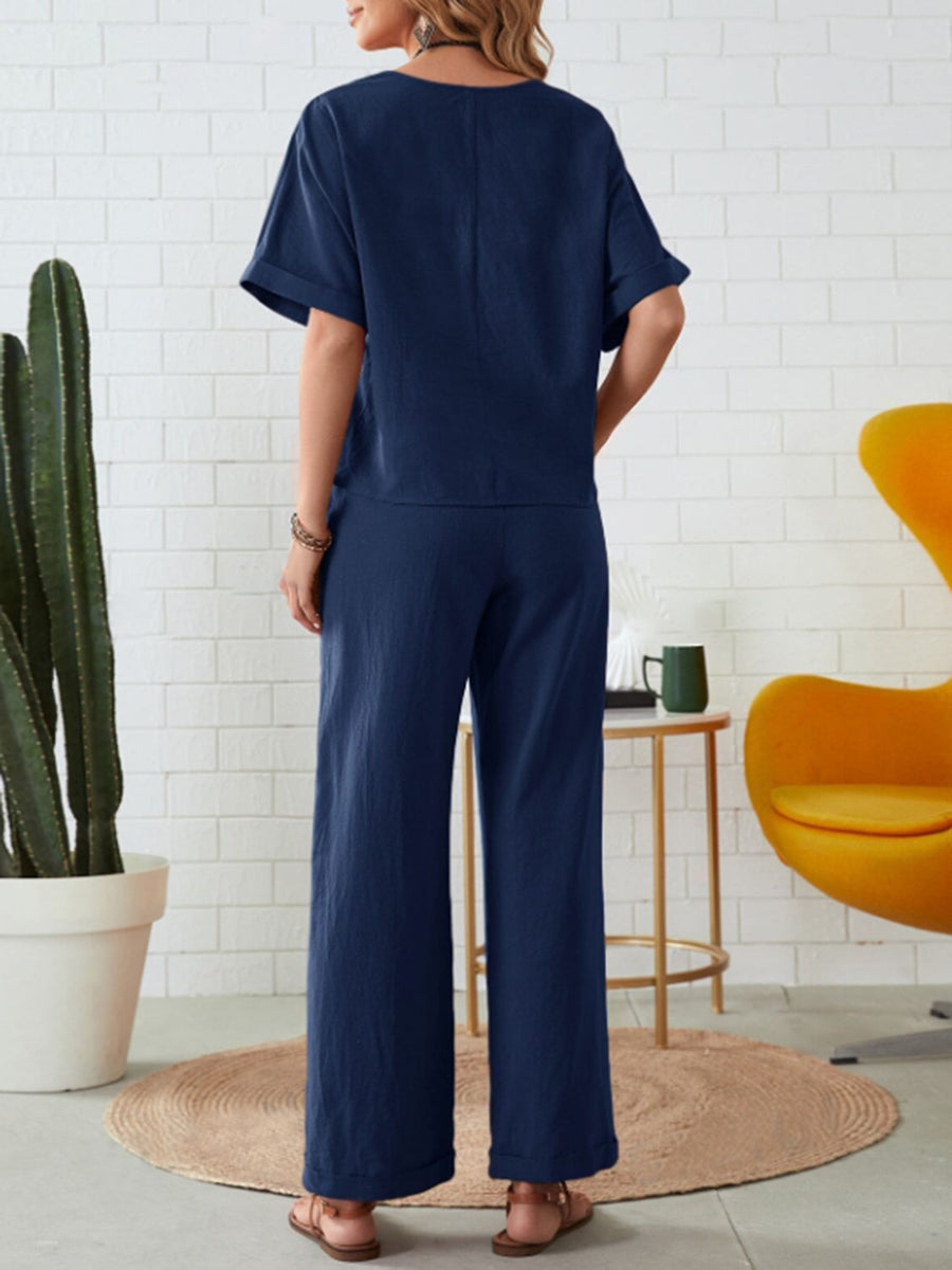 Dark blue linen co-ord set with wide leg pants and a relaxed fit top.