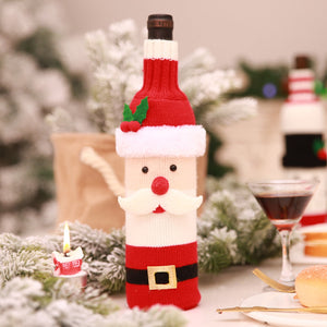 Festive knit bottle cover in Santa Claus design, red and white with black belt detail.