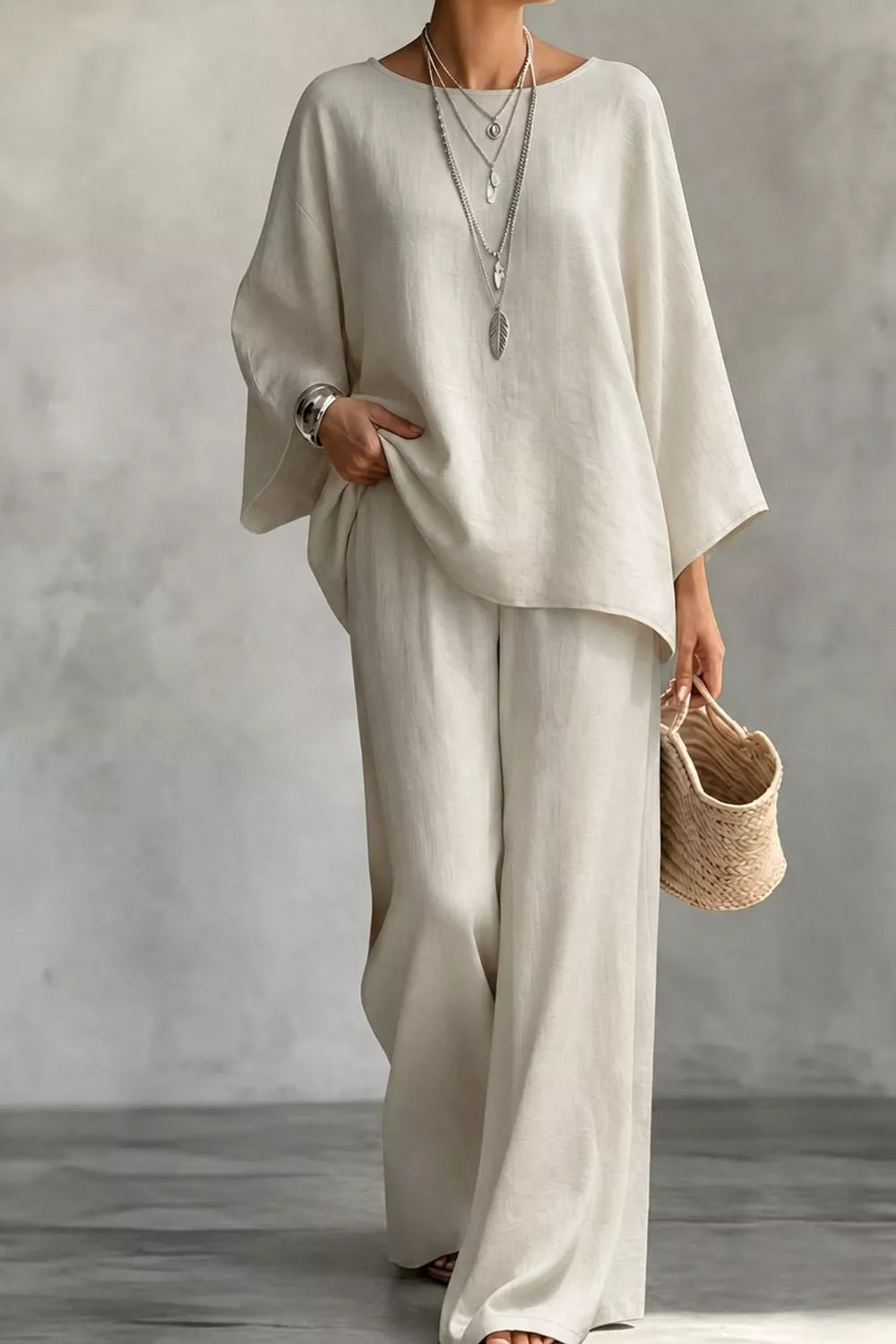 two-piece set in ivory featuring boat neck and relaxed fit