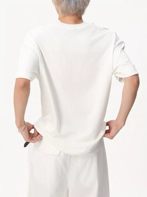 White cotton t-shirt with round neck and short sleeves, shown from the back.