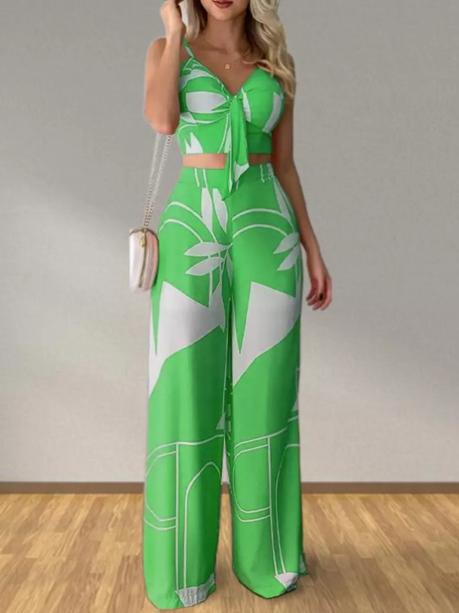 Light green tropical print crop top with tie front and wide leg pants set.