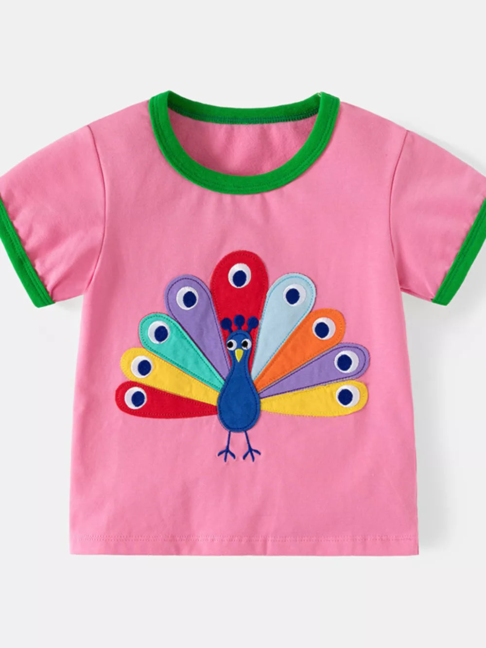 Pink cotton toddler t-shirt with colorful peacock embroidery and green trim