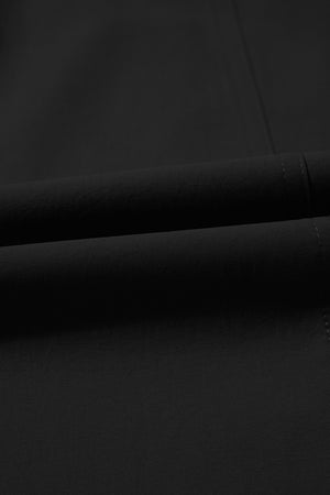 Black cropped pants with drawstring elastic waist and visible stitching detail.