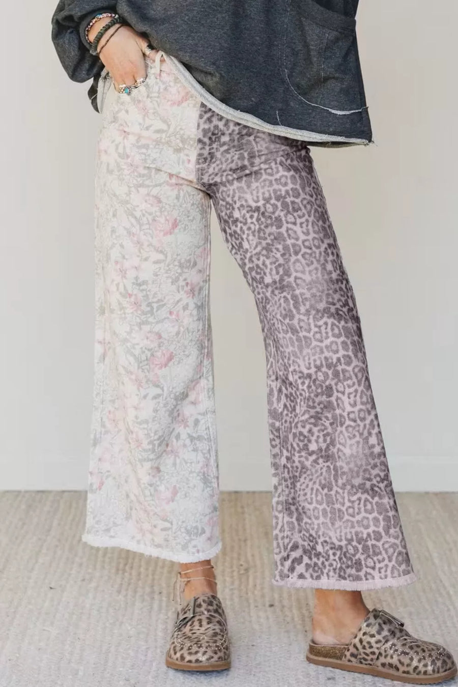 Floral and leopard print wide-leg jeans with frayed hem.