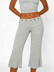 Light gray flared hem capri pants with button detail at waist