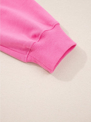Hot pink pullover sleeve cuff detail with ribbed texture