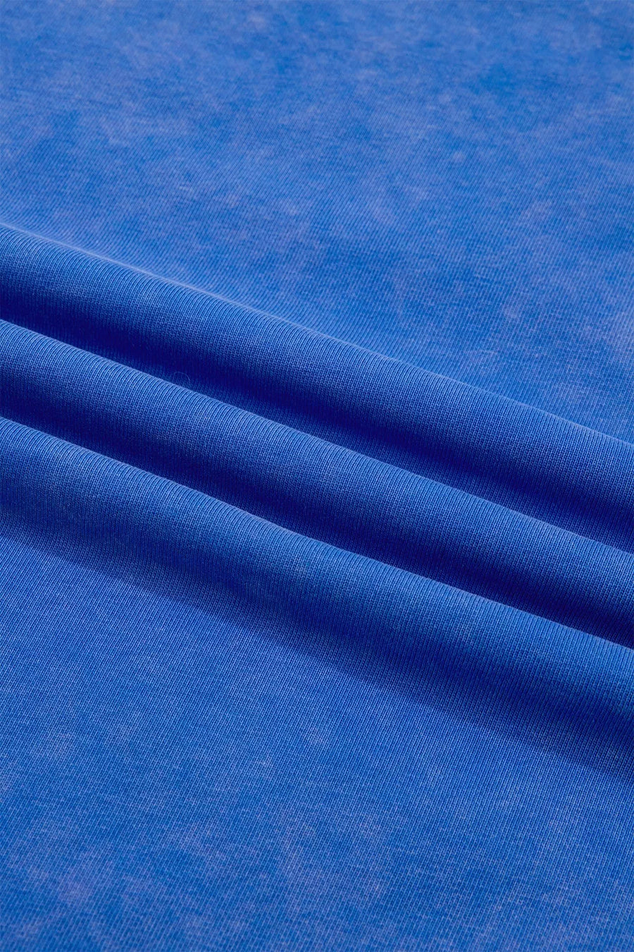 Blue cotton t-shirt with a washed effect and ribbed texture detail.