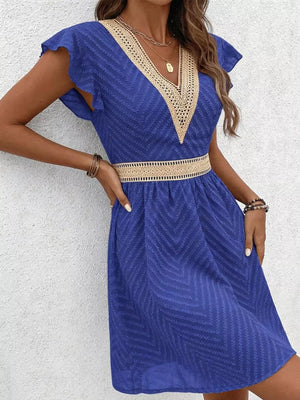 Royal blue chevron textured V-neck mini dress with lace trim and defined waist