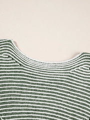 Relaxed ribbed knit sweater with boat neck in stripe pattern.